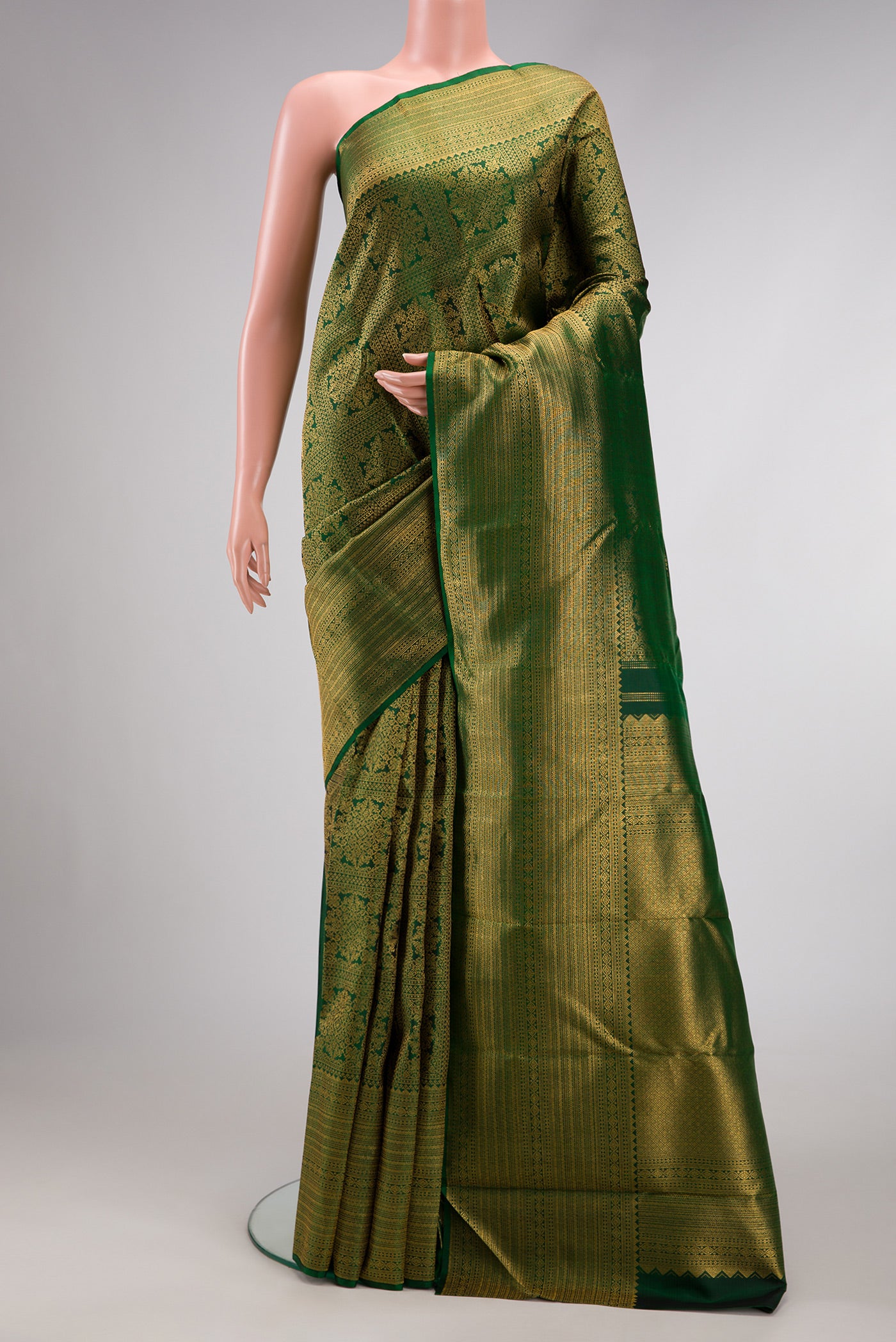 Green Dual Tone Kanjivaram Silk Saree with Zari Brocade on the body and Zari Border.  displayed on a mannequin