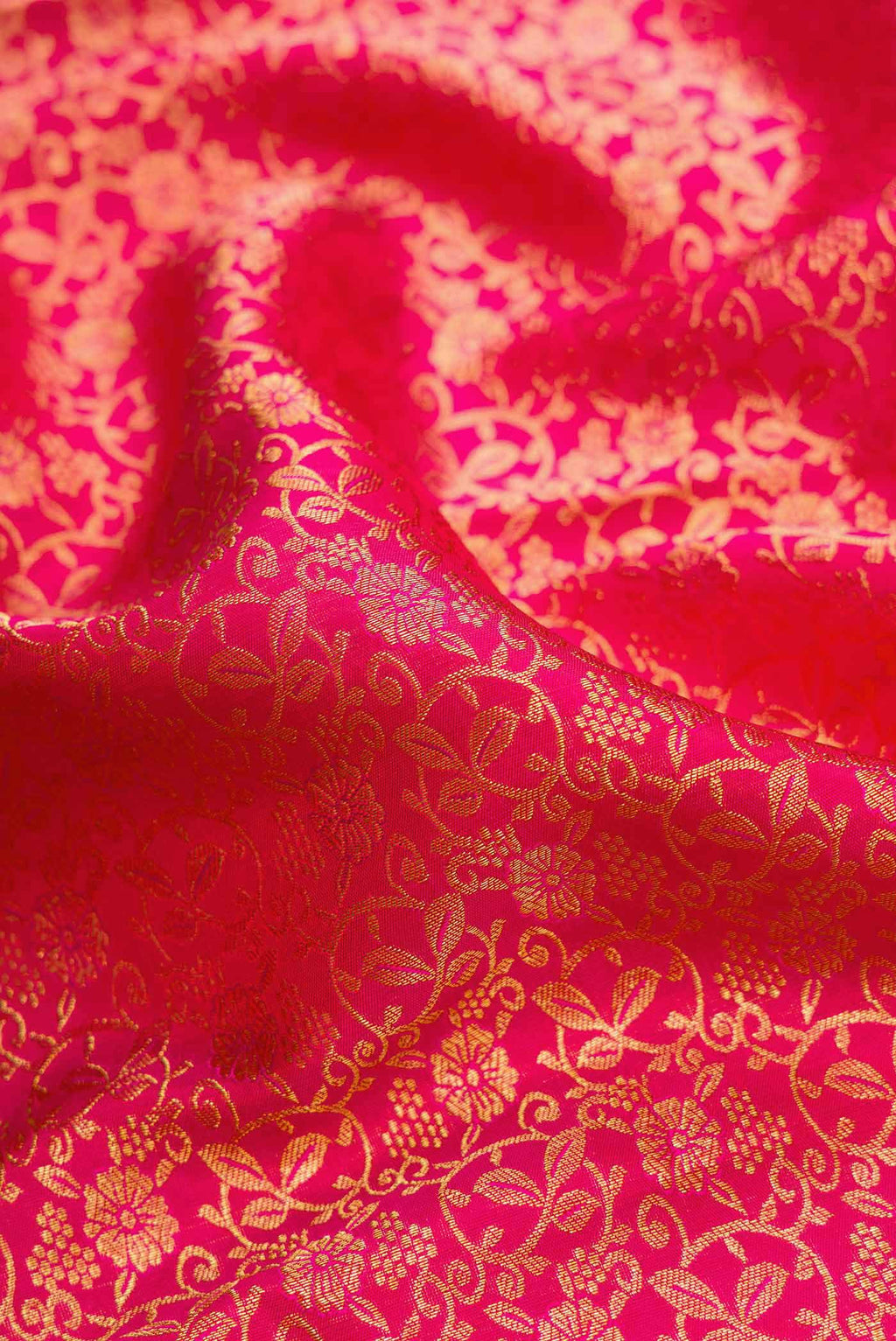 Close up of Pink Dual Tone Kanchipuram Silk Saree with Zari Brocade on the body and Zari Border.  displaying folds