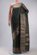 Green Kanchipuram Silk Saree with Checked design on the body and Zari Border displayed on a mannequin