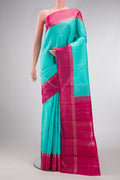 Sea Green Dual Tone Kanjivaram Silk Saree with Plain Body and Zari Border.  displayed on a mannequin