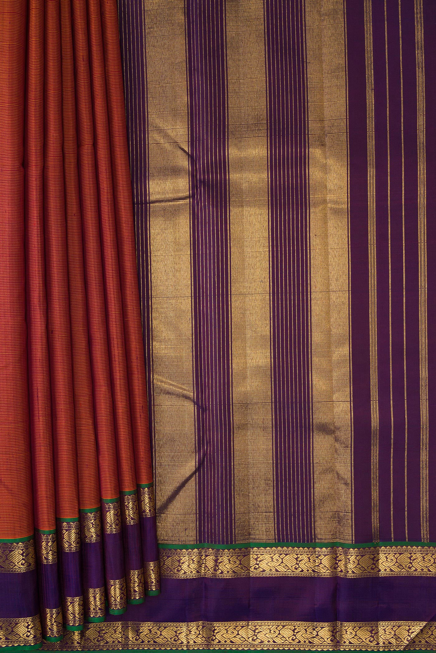 Pleats and pallu of Brick Orange Dual Tone Kanjivaram Silk Saree with Stripes on the body and Zari Border. 