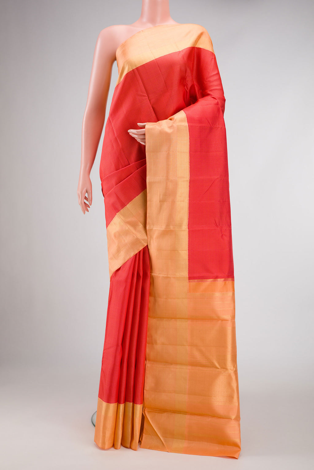 Dark Pink Dual Tone Kanjivaram Silk Saree with Checked design on the body and Zari Border.  displayed on a mannequin