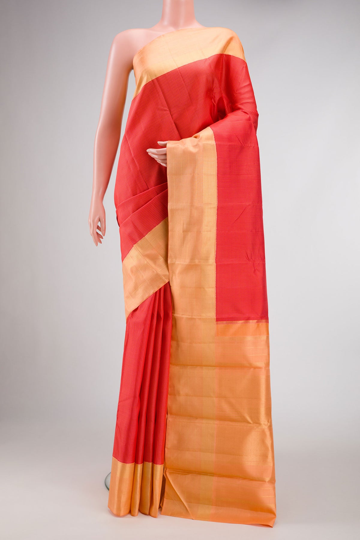 Dark Pink Dual Tone Kanjivaram Silk Saree with Checked design on the body and Zari Border.  displayed on a mannequin