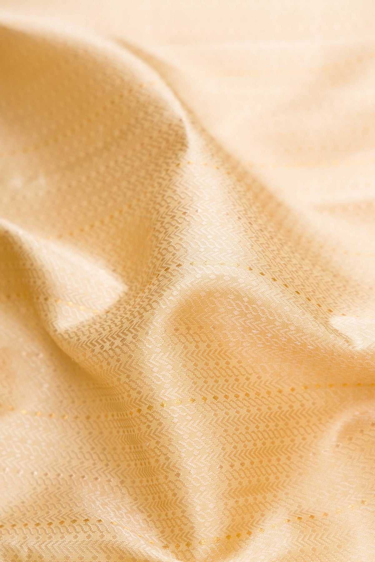 Close up of Sandal Dual Tone Kanjivaram Silk Saree with Jacquard With Zari Butta on the body and Zari Border.  displaying folds