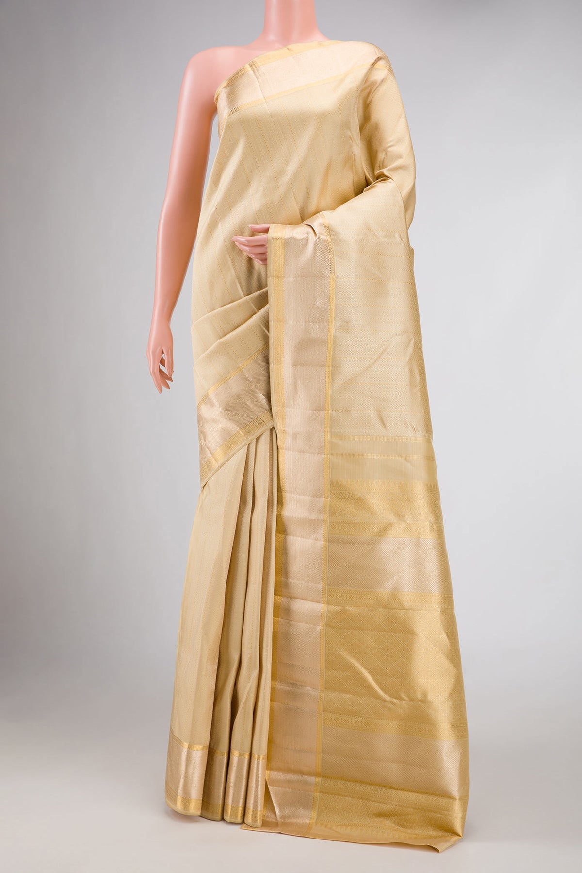 Sandal Dual Tone Kanjivaram Silk Saree with Jacquard With Zari Butta on the body and Zari Border.  displayed on a mannequin