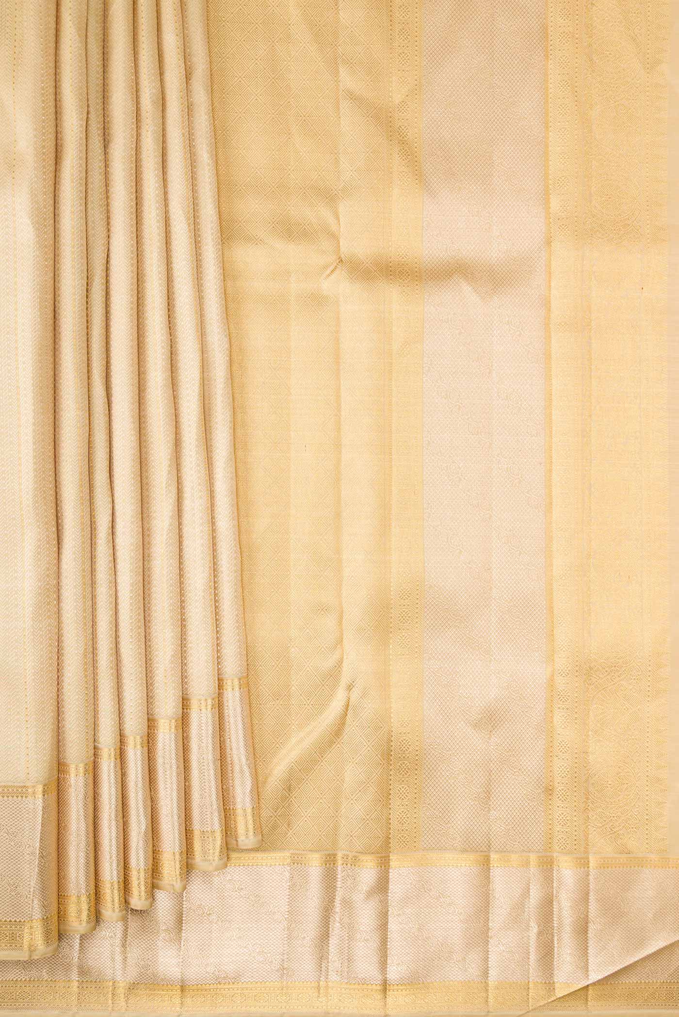 Pleats and pallu of Sandal Dual Tone Kanjivaram Silk Saree with Jacquard With Zari Butta on the body and Zari Border. 