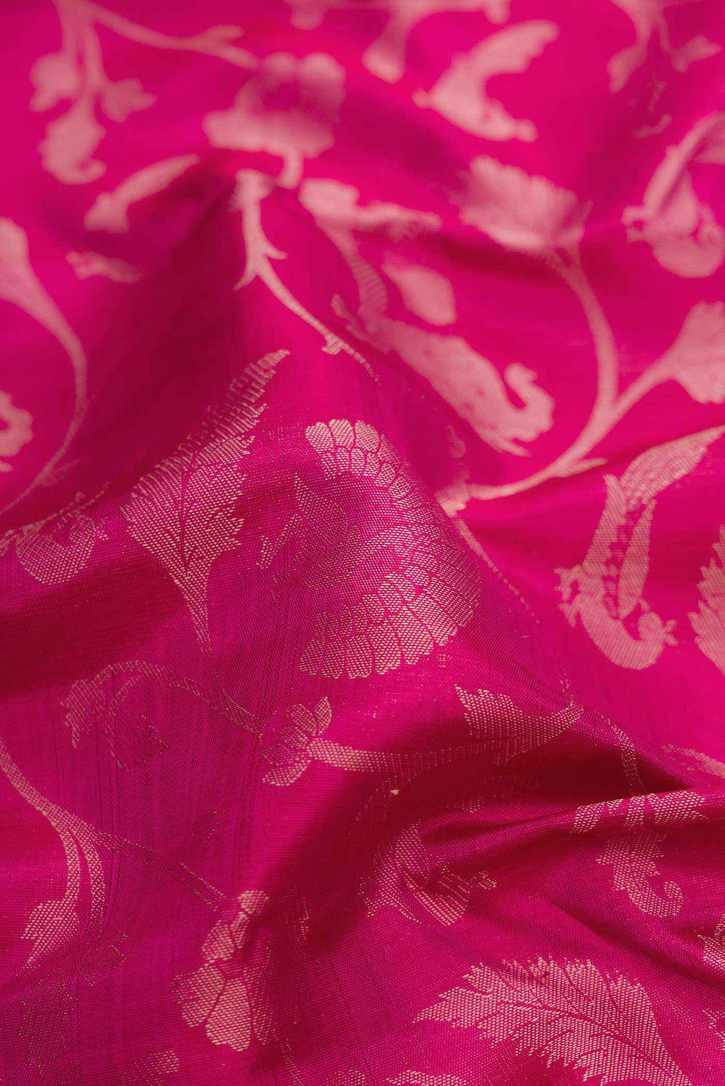 Close up of Pure Silk Pure Zari Dark Pink Dual Tone Kanchipuram Saree with Jacquard design on the body and Zari Border displaying folds