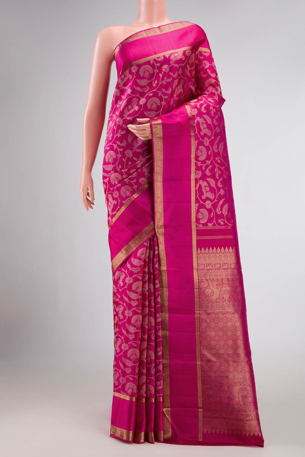 Pure Silk Pure Zari Dark Pink Dual Tone Kanchipuram Saree with Jacquard design on the body and Zari Border displayed on a mannequin