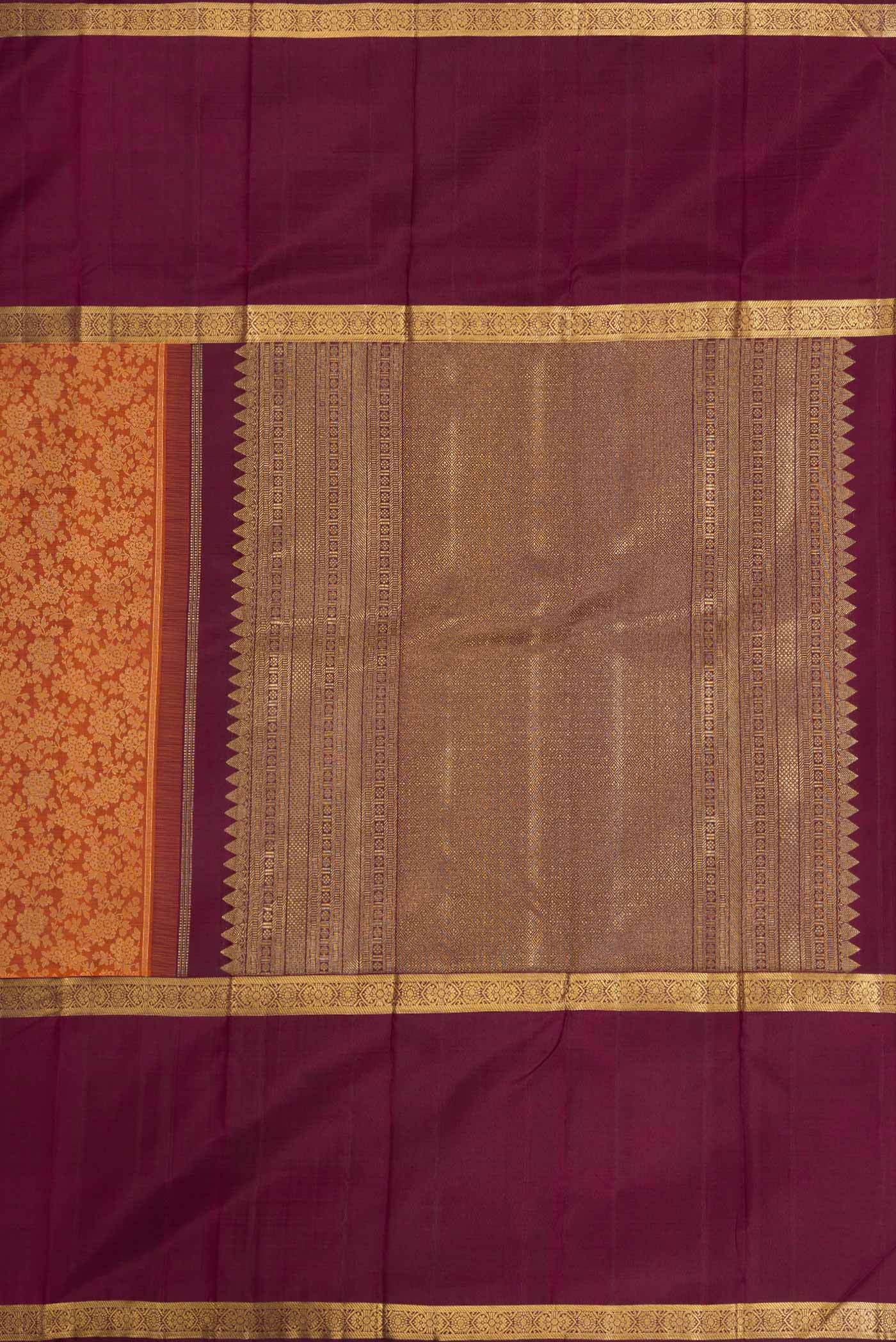 Close up image of the pallu of Brick Orange Dual Tone Kanchipuram Silk Saree with Jacquard design on the body and Zari Border