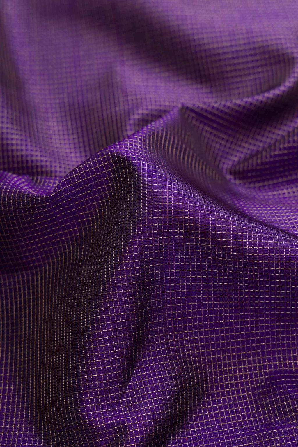 Close up of Pure Silk Pure Zari Navy Blue Dual Tone Kanchipuram Saree with Stripes on the body and Zari Border displaying folds