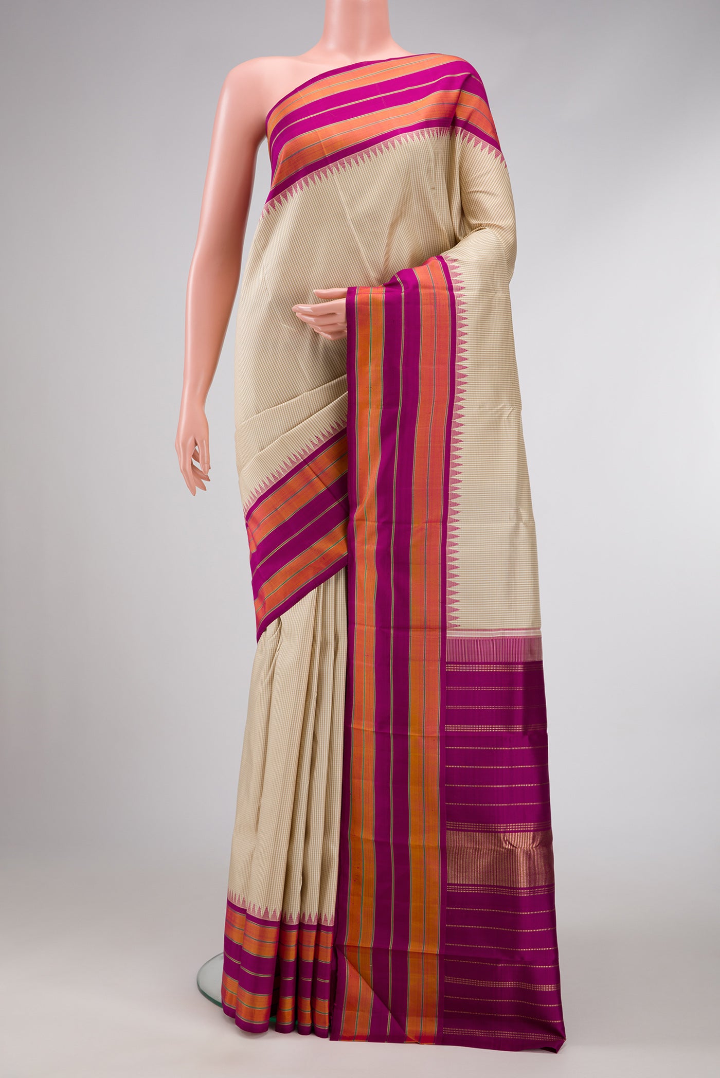 Dark Beige Dual Tone Kanjivaram Silk Saree with Checked design on the body and Zari Border.  displayed on a mannequin