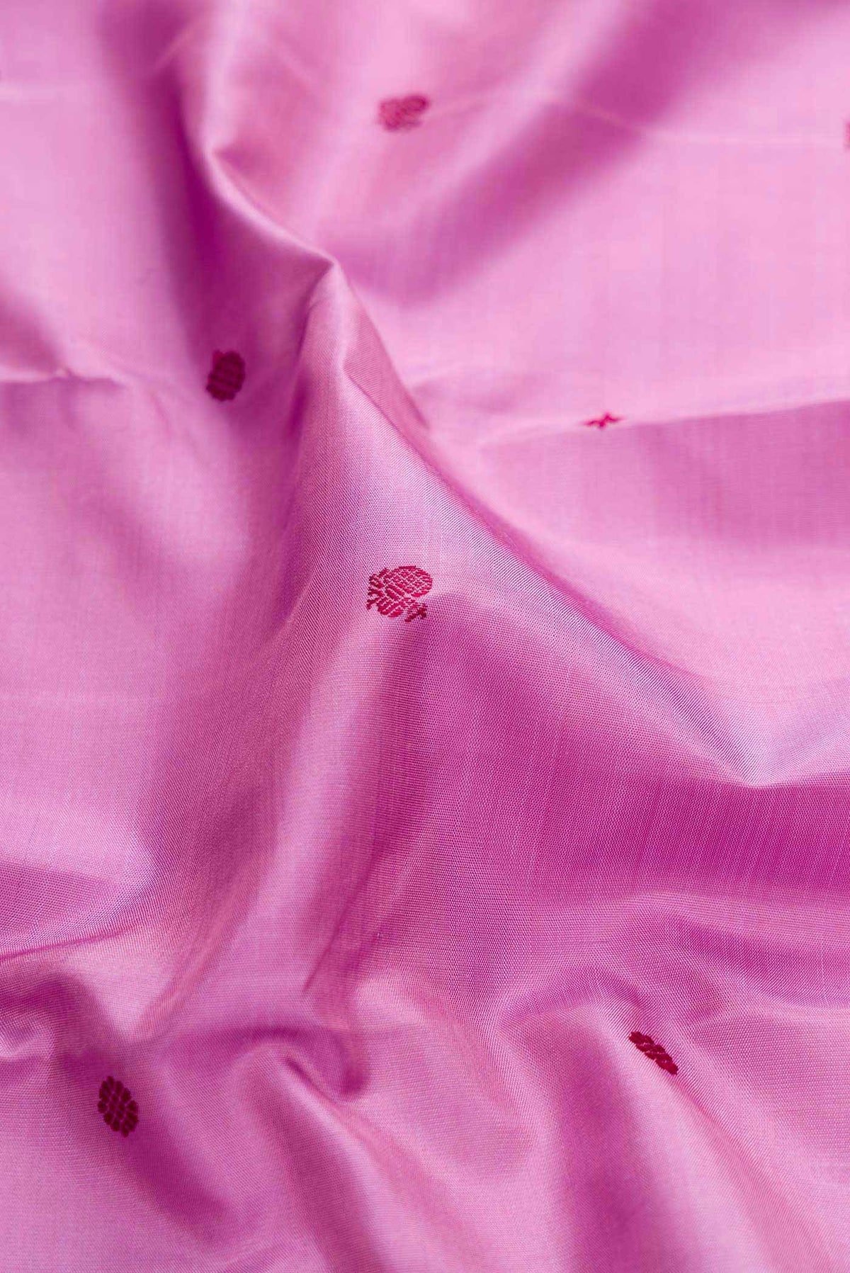 Close up of Pure Silk Pure Zari Lavender Dual Tone Kanchipuram Saree with Thread Butta on the body and Zari Border displaying folds