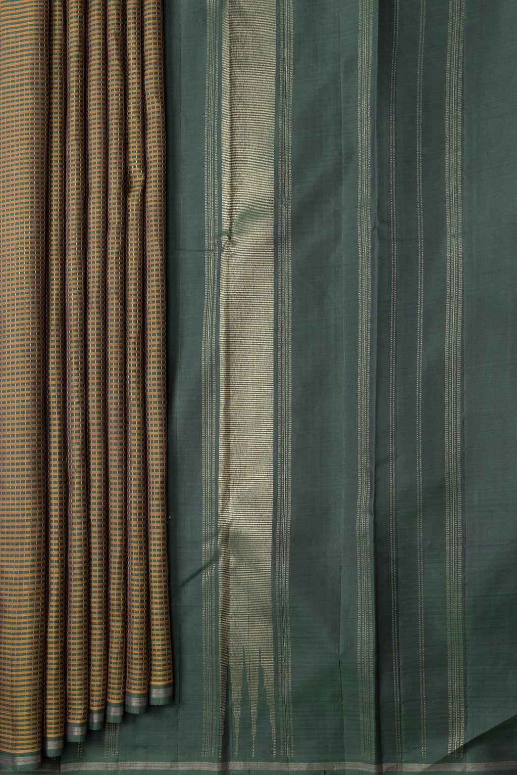 Pleats and pallu of Bottle Green Dual Tone Kanchipuram Silk Saree with Checked design on the body and Zari Border. 