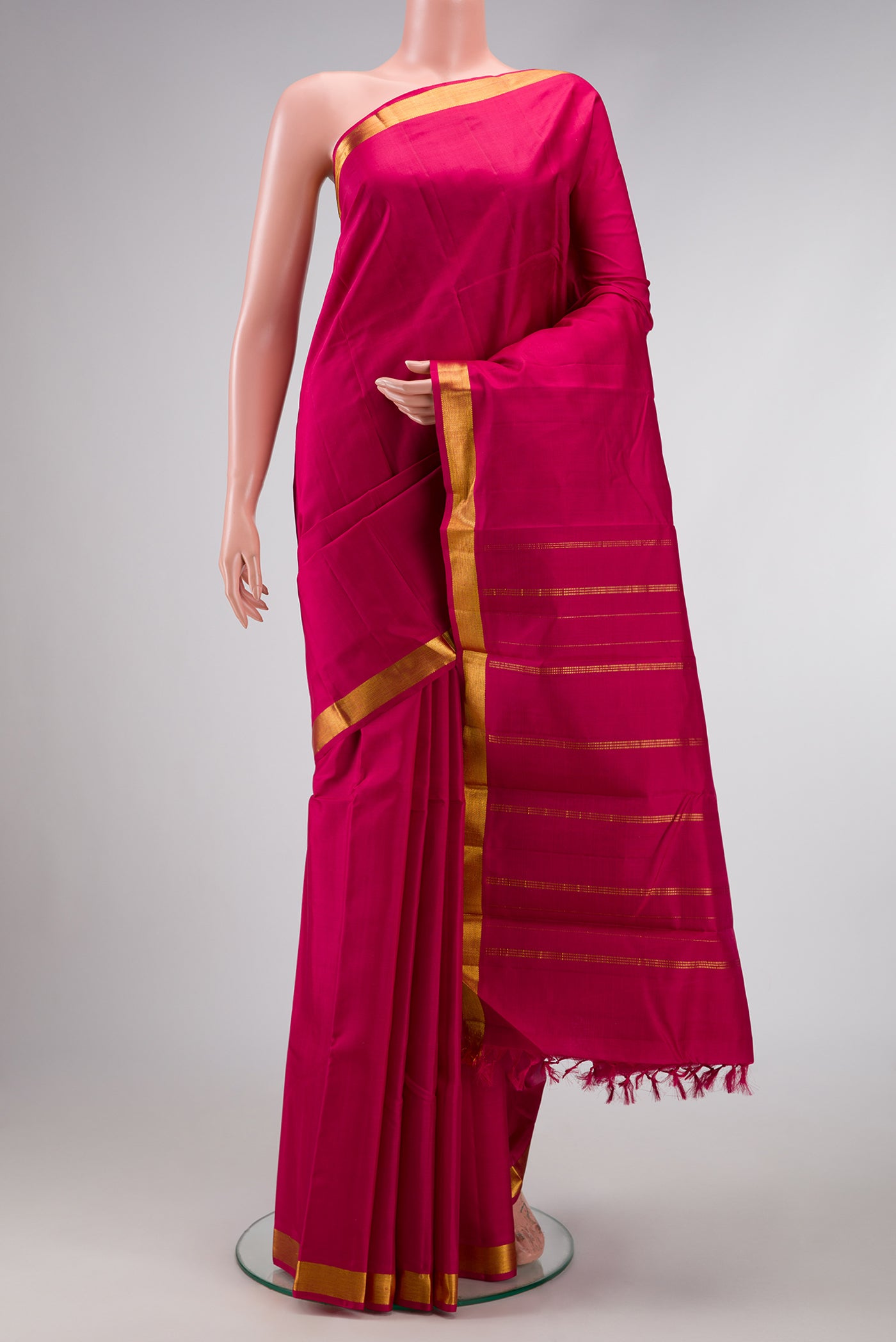 Pure Silk Pure Zari Maroon Dual Tone Kanjivaram Saree with Plain Body and Zari Border.  displayed on a mannequin