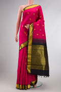 Pink Dual Tone Kanchipuram Silk Saree with Zari Butta on the body and Zari Border displayed on a mannequin