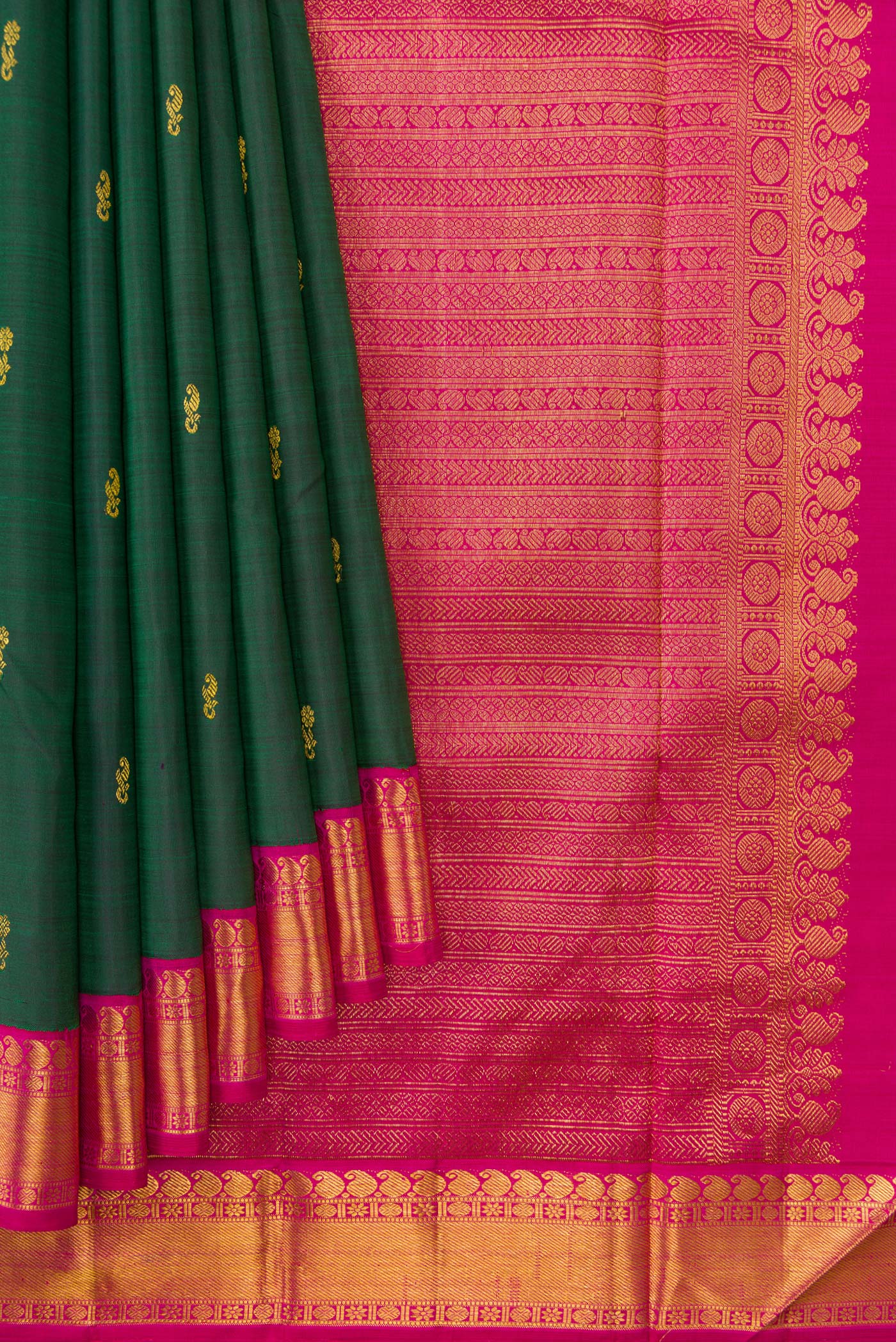 Pleats and pallu of Bottle Green Dual Tone Kanjivaram Silk Saree with Zari Butta on the body and Zari Border. 