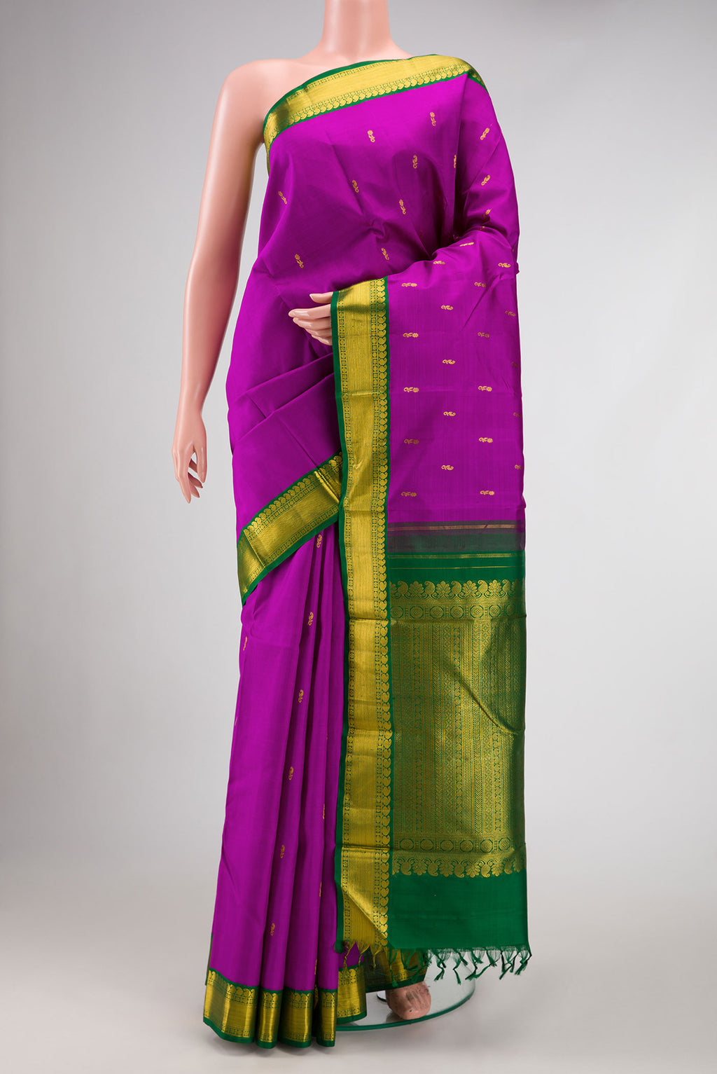 Magenta Dual Tone Kanjivaram Silk Saree with Zari Butta on the body and Zari Border.  displayed on a mannequin