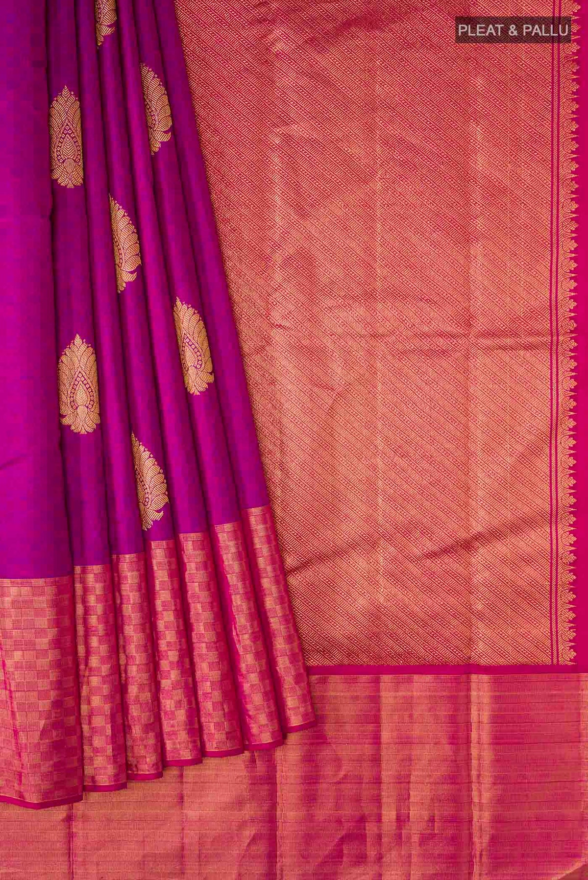 Pleats and pallu of Purple Kanchipuram Silk Saree with Zari Butta on the body and Zari Border