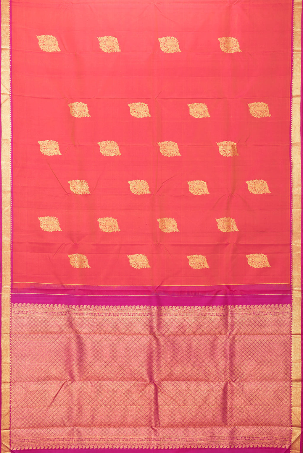 Flat view of Coral Dual Tone Kanchipuram Silk Saree with Zari Butta on the body and Zari Border. 