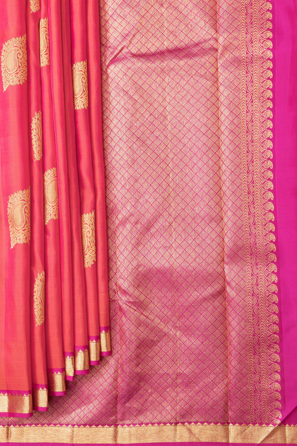 Pleats and pallu of Coral Dual Tone Kanchipuram Silk Saree with Zari Butta on the body and Zari Border. 
