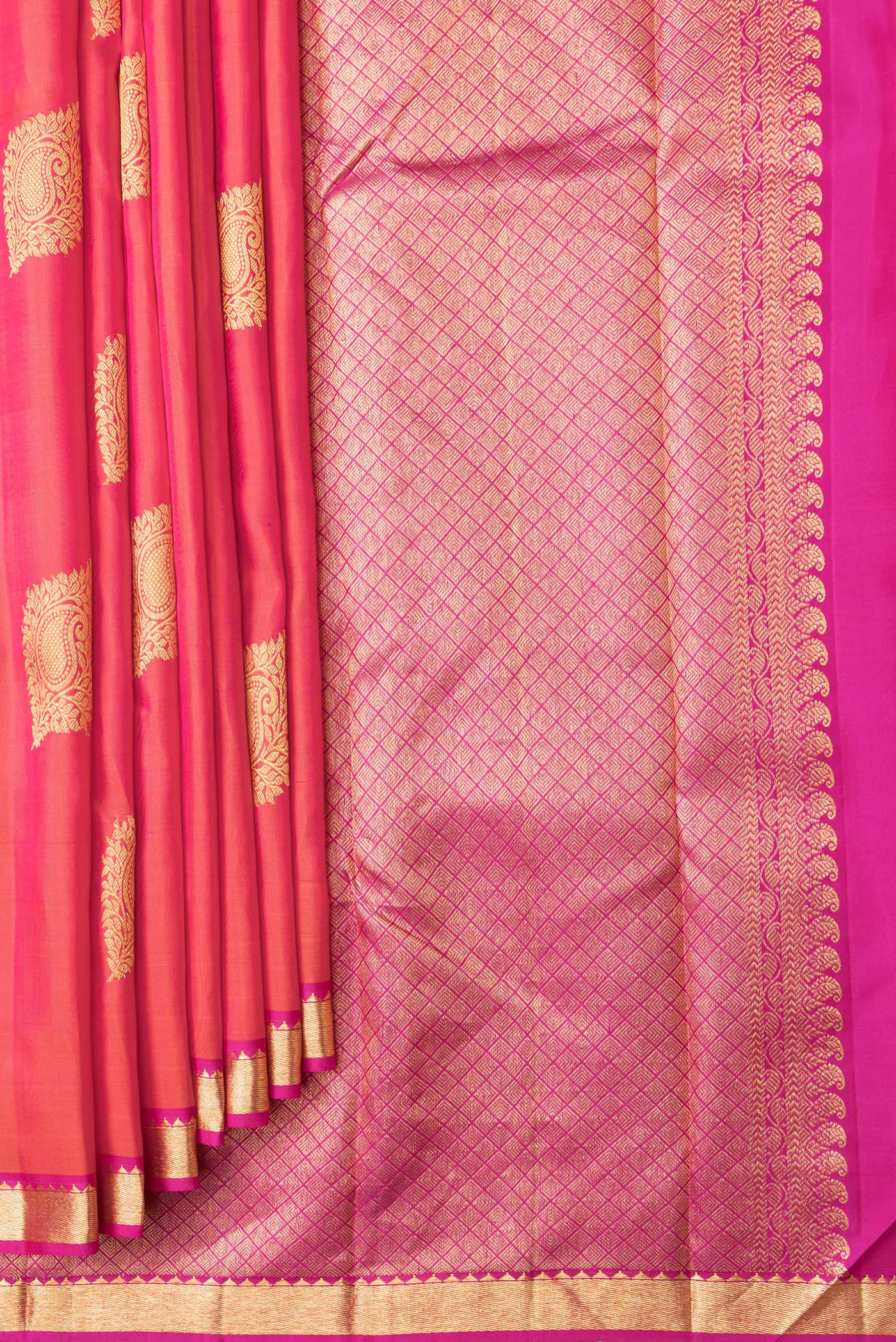 Pleats and pallu of Coral Dual Tone Kanchipuram Silk Saree with Zari Butta on the body and Zari Border. 