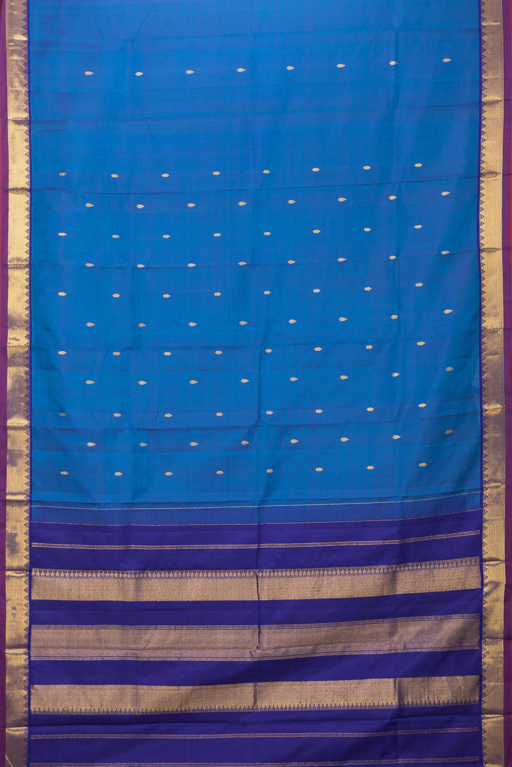 Flat view of Peacock Blue Dual Tone Kanchipuram Silk Saree with Zari Butta on the body and Zari Border. 