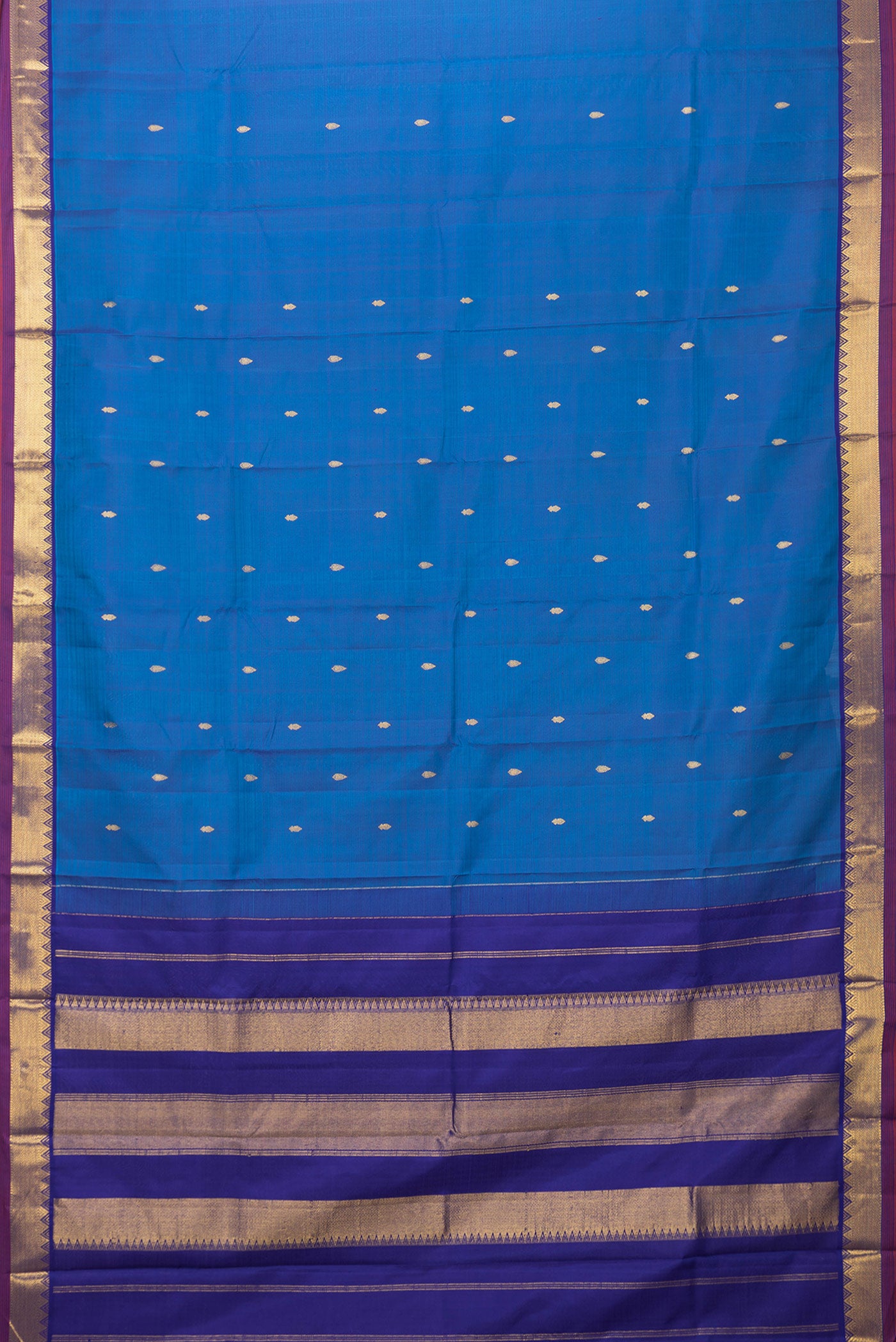 Flat view of Peacock Blue Dual Tone Kanchipuram Silk Saree with Zari Butta on the body and Zari Border. 