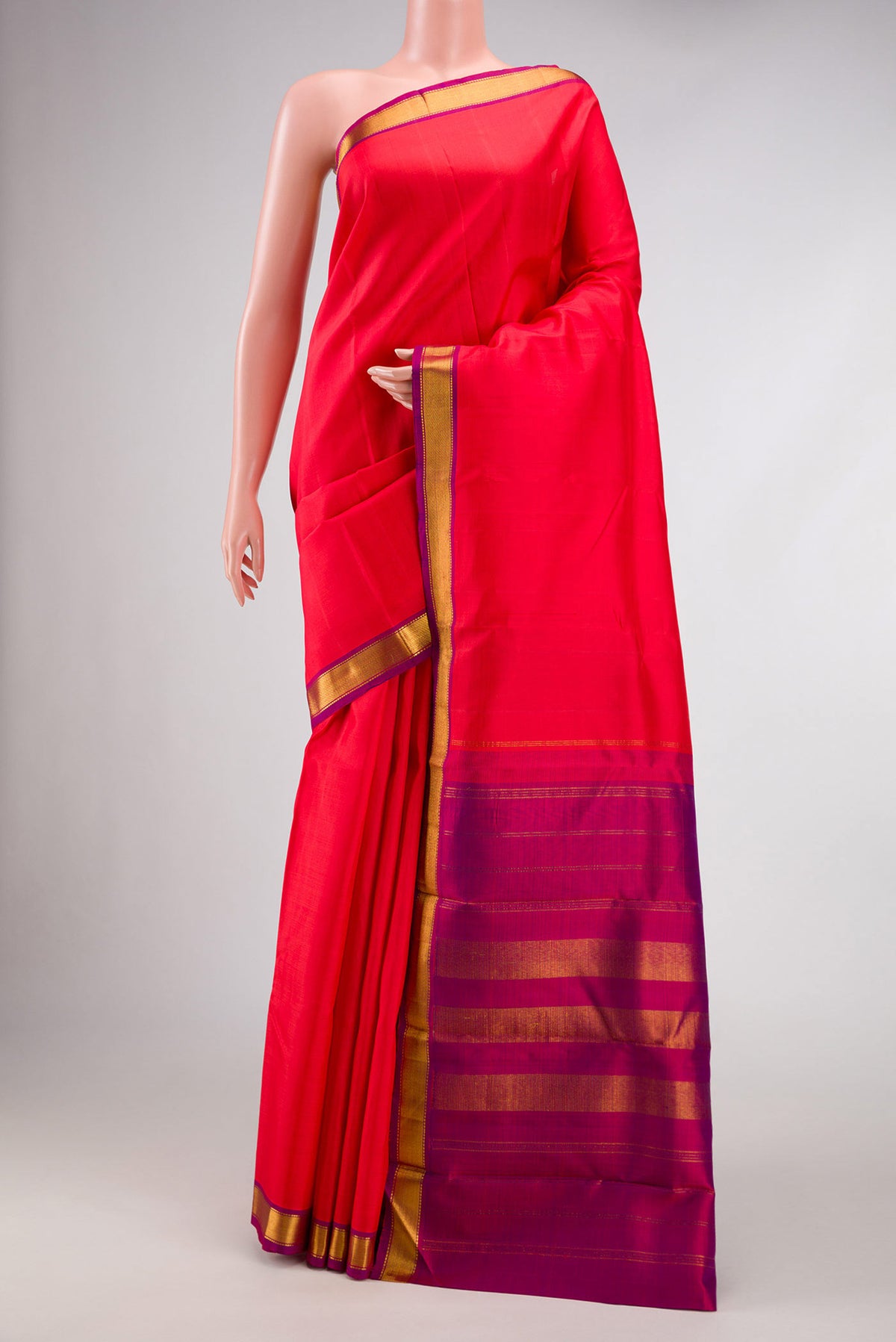 Red Dual Tone Kanjivaram Silk Saree with Plain Body and Zari Border.  displayed on a mannequin