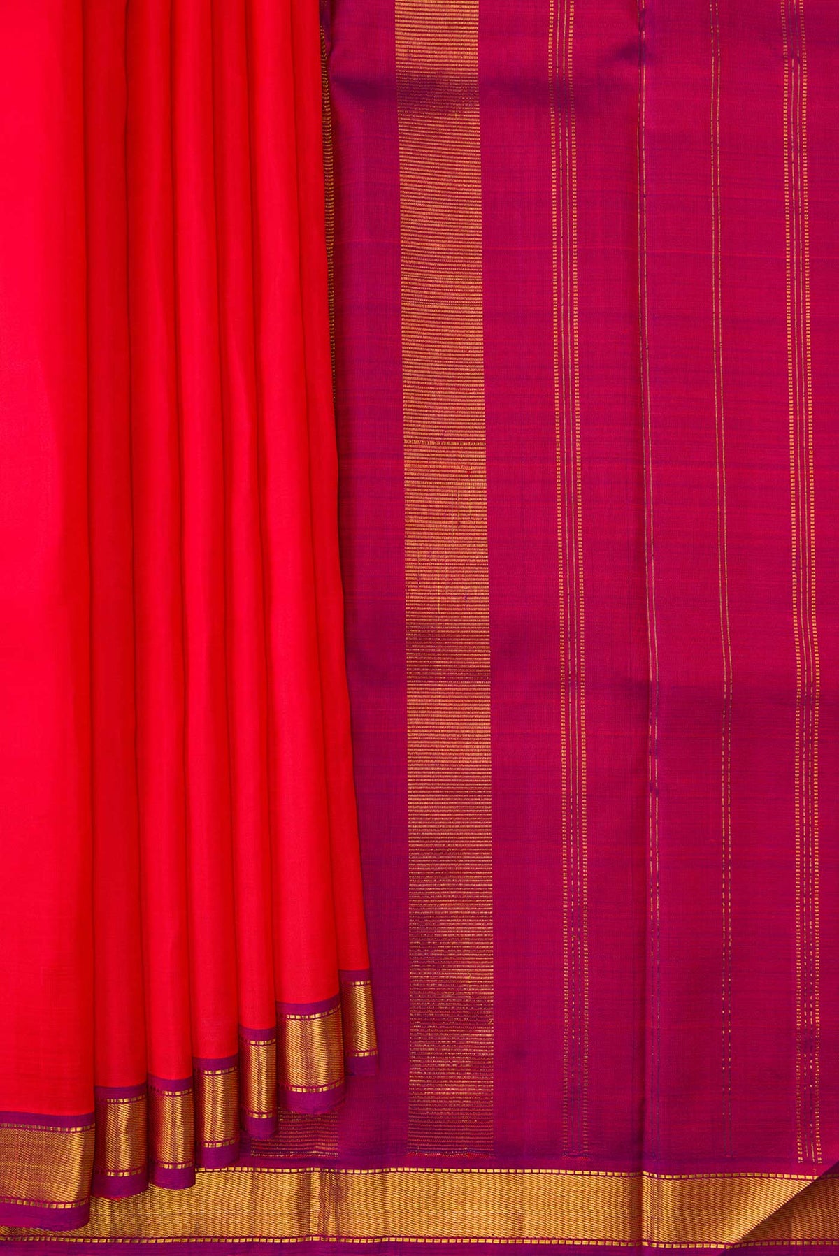 Pleats and pallu of Red Dual Tone Kanjivaram Silk Saree with Plain Body and Zari Border. 