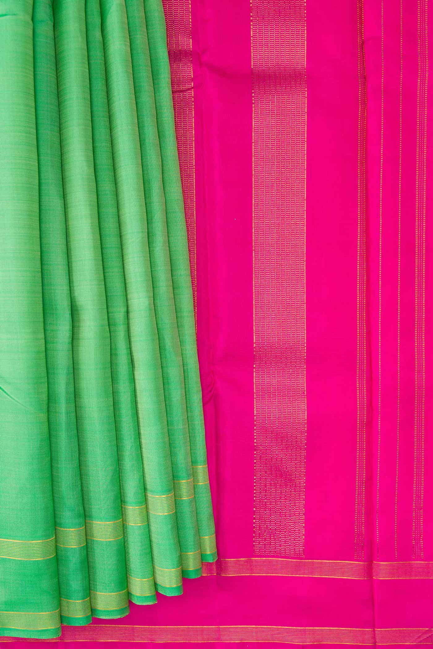 Pleats and pallu of Pista Green Dual Tone Kanjivaram Silk Saree with Plain Body and Zari Border. 