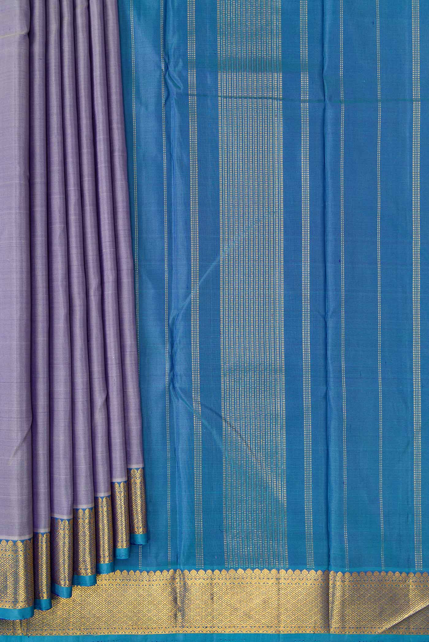 Pleats and pallu of Lavender Dual Tone Kanchipuram Silk Saree with Plain Body and Zari Border. 