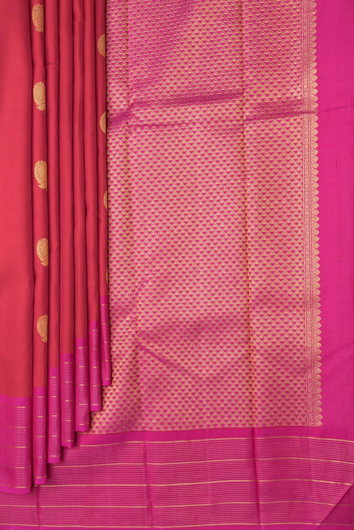 Pleats and pallu of Red Dual Tone Kanchipuram Silk Saree with Zari Butta on the body and Zari Border. 