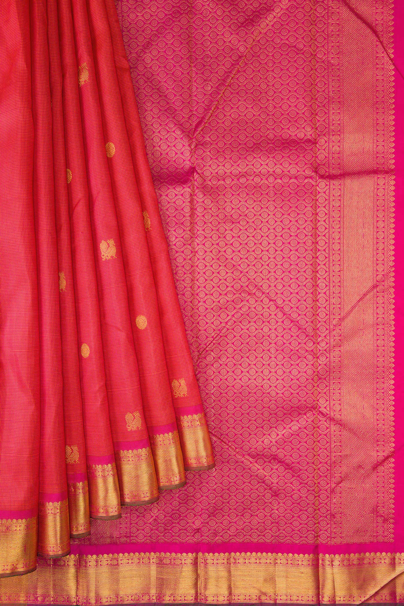 Pleats and pallu of Coral Dual Tone Kanchipuram Silk Saree with Checked design on the body and Zari Border. 