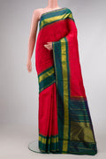 Red Dual Tone Kanchipuram Silk Saree with Checked design on the body and Zari Border.  displayed on a mannequin