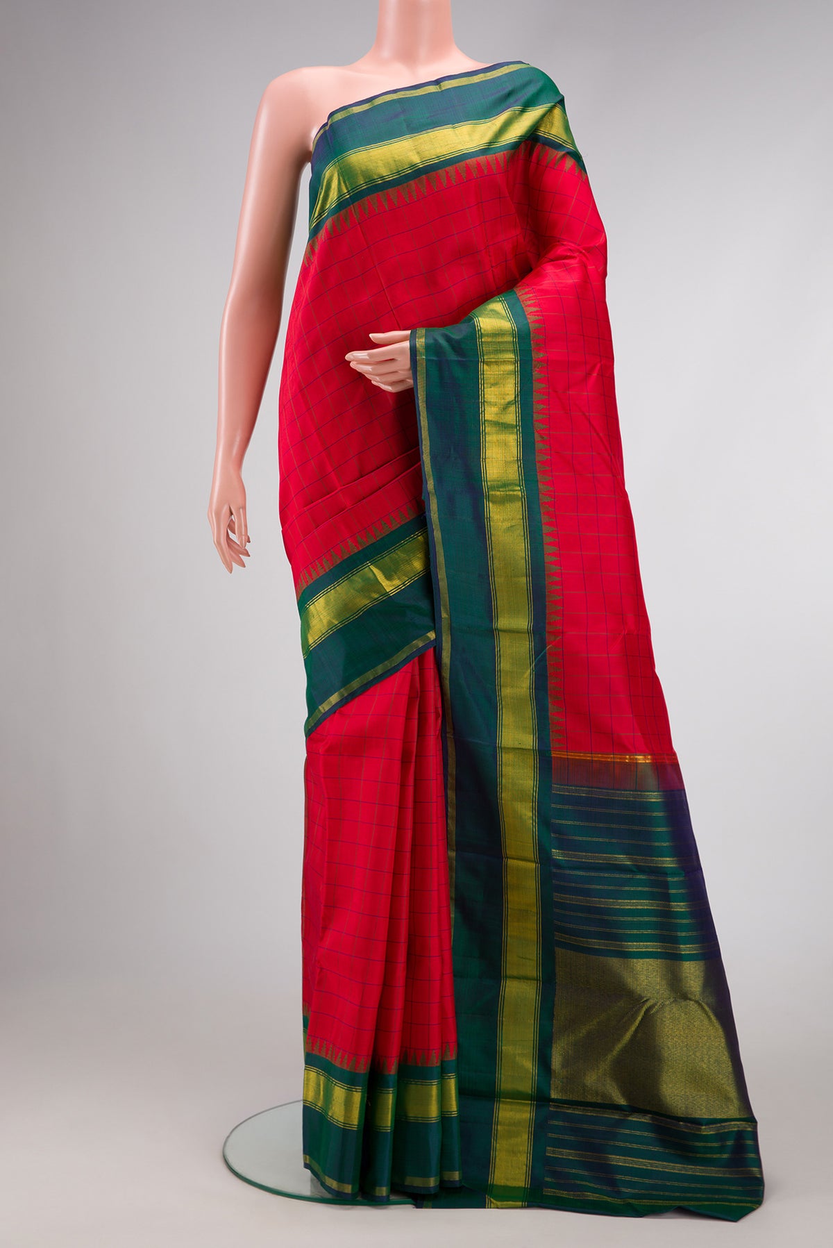 Red Dual Tone Kanchipuram Silk Saree with Checked design on the body and Zari Border.  displayed on a mannequin