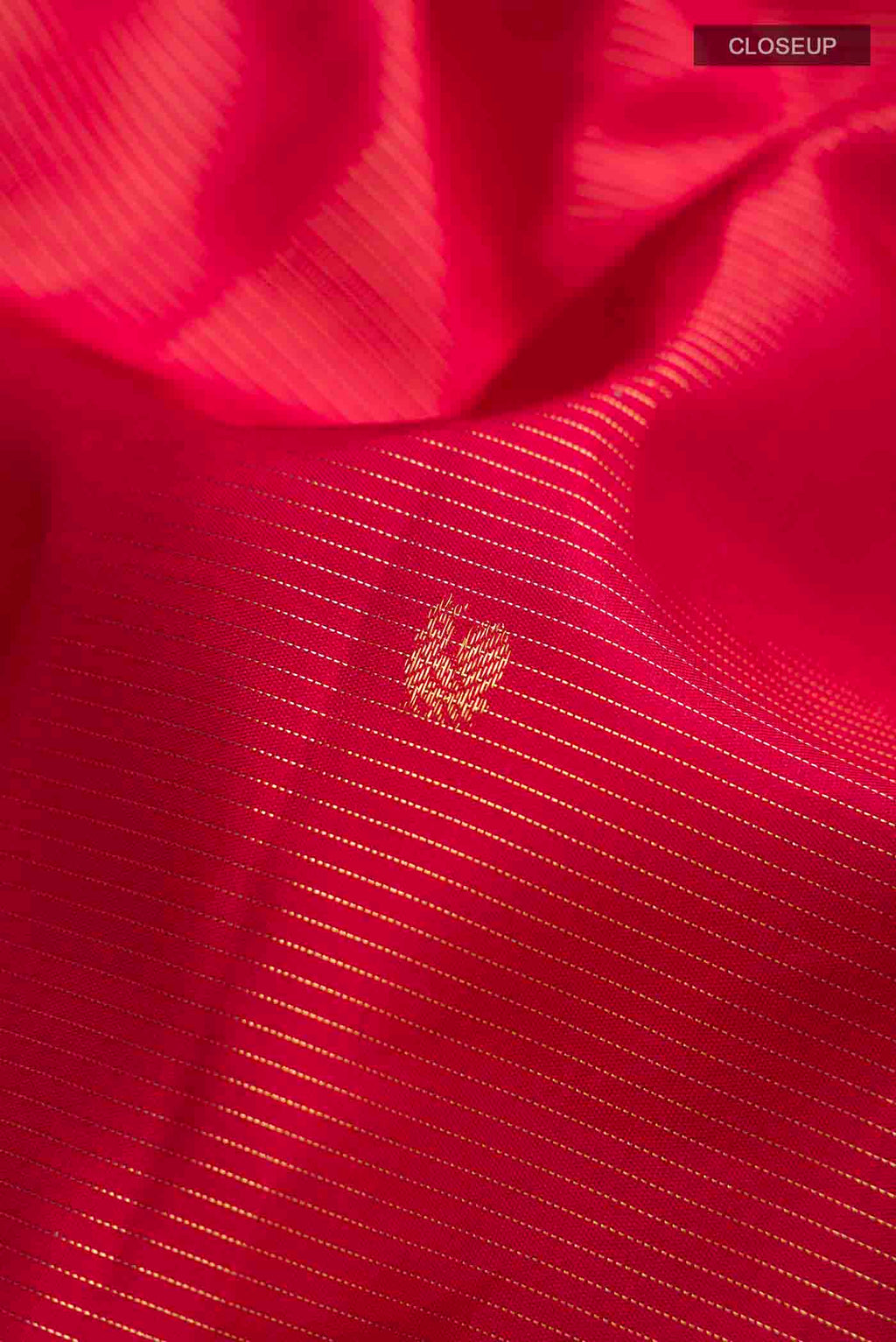 Close up of Maroon Kanchipuram Silk Saree with Stripes on the body and Zari Border displaying folds