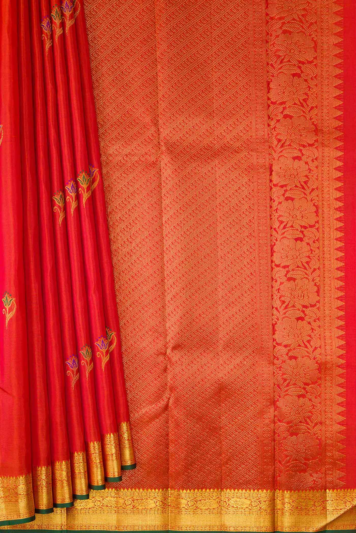 Pleats and pallu of Orange Dual Tone Kanchipuram Silk Saree with Zari And Thread Butta on the body and Zari Border. 