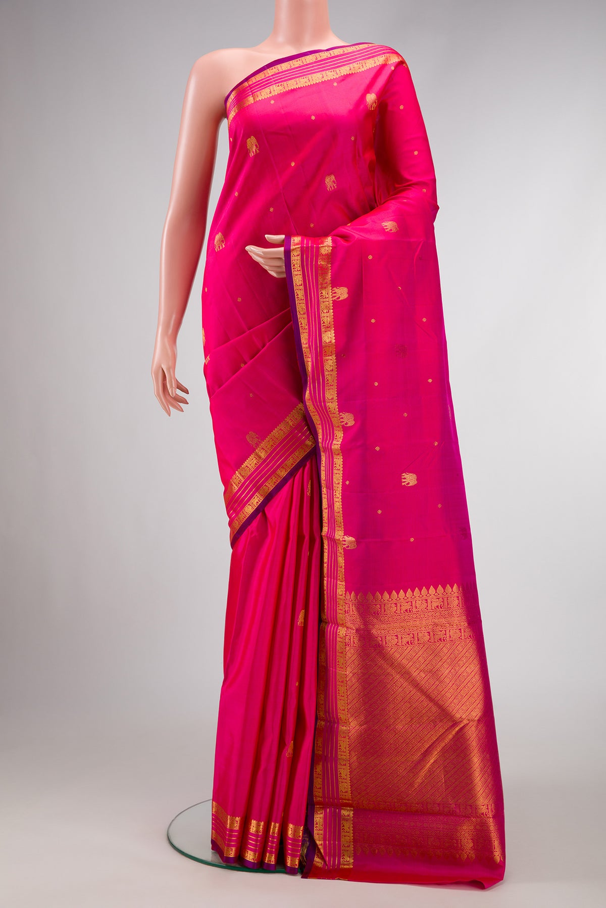 Pink Dual Tone Kanchipuram Silk Saree with Zari Butta on the body and Zari Border.  displayed on a mannequin