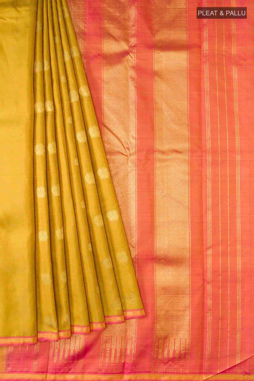 Pleats and pallu of Green Kanchipuram Silk Saree with Zari Butta on the body and Zari Border