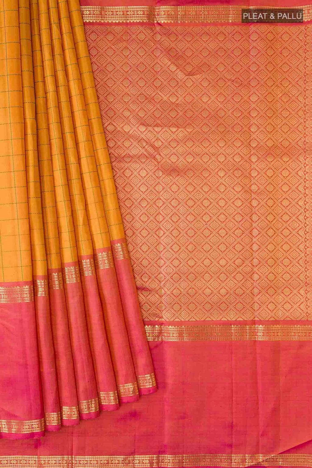 Pleats and pallu of Mustard Kanchipuram Silk Saree with Checked design on the body and Ganga Jamuna Border