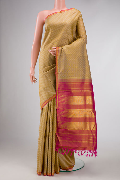 Beige Dual Tone Kanchipuram Silk Saree with Zari Butta on the body and Zari Border displayed on a mannequin