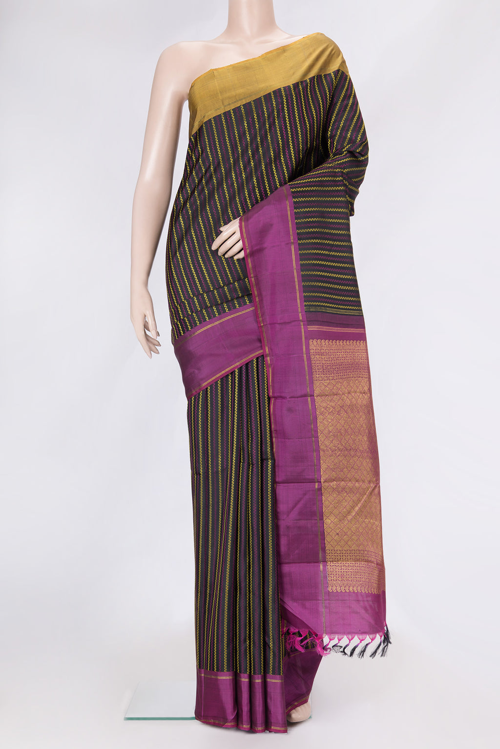 Black Dual Tone Kanchipuram Silk Saree with Stripes on the body and Ganga Jamuna Border.  displayed on a mannequin