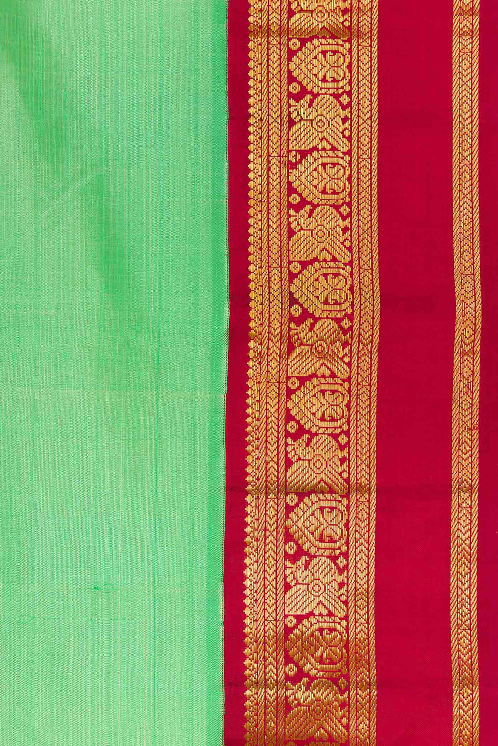 Border image of Pista Green Dual Tone Kanjivaram Silk Saree with Plain Body and Zari Border. 