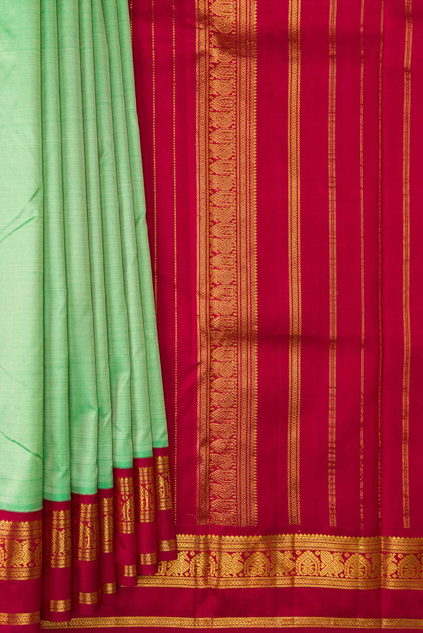 Pleats and pallu of Pista Green Dual Tone Kanjivaram Silk Saree with Plain Body and Zari Border. 
