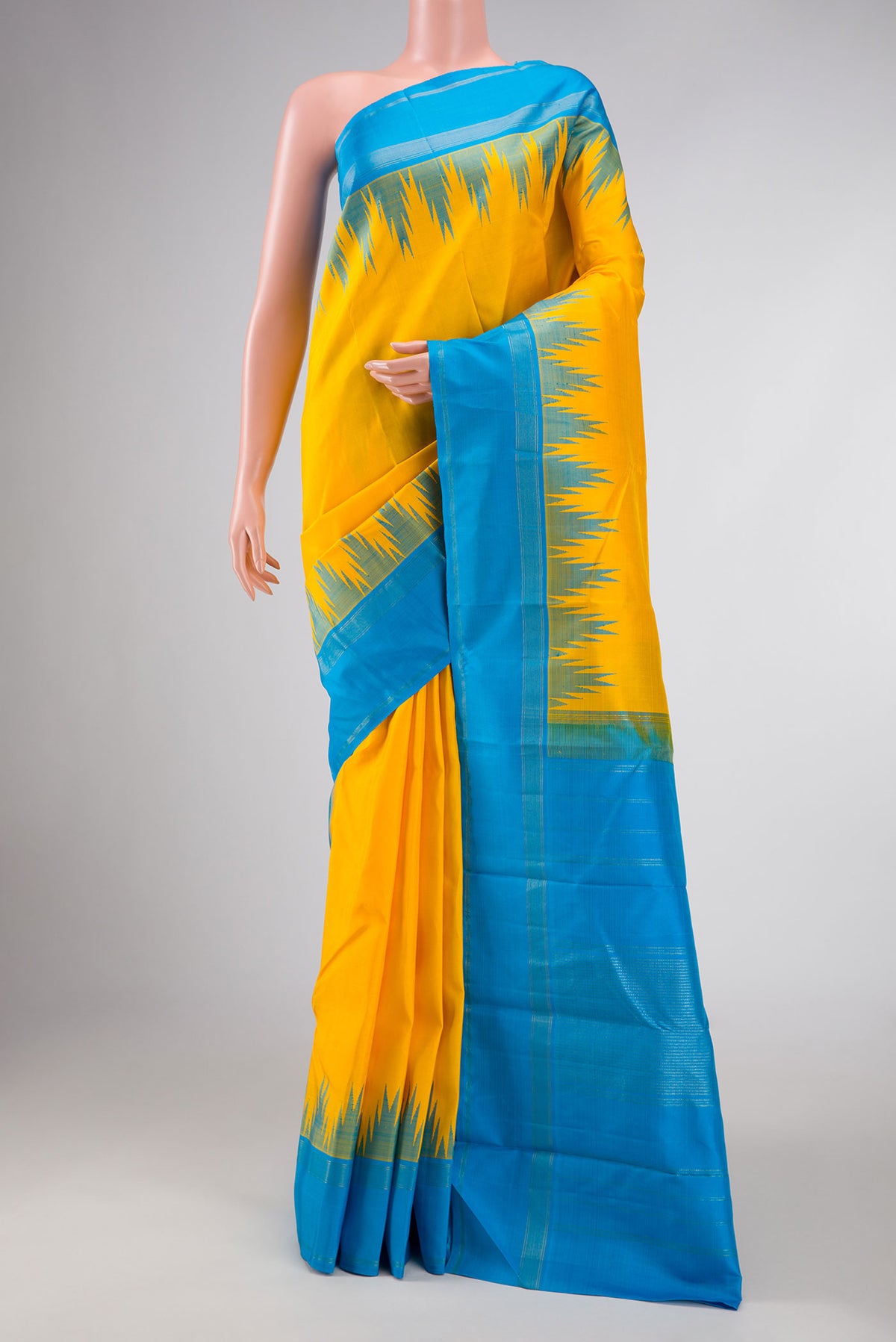 Yellow Dual Tone Kanchipuram Silk Saree with Plain Body and Temple Border displayed on a mannequin