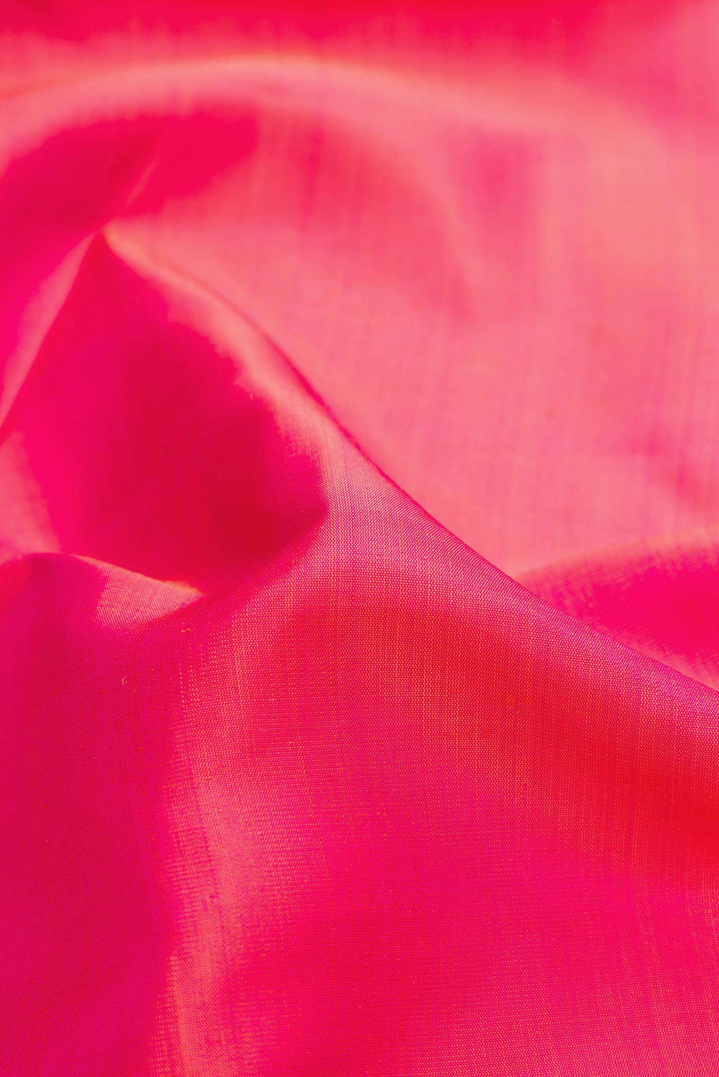 Close up of Pink Dual Tone Kanjivaram Silk Saree with Plain Body and Temple Border.  displaying folds