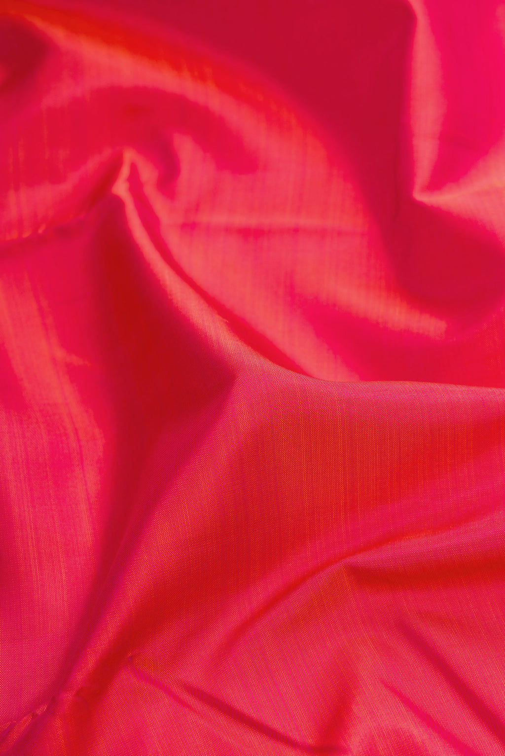 Close up of Pink Dual Tone Kanjivaram Silk Saree with Plain Body and Zari Border.  displaying folds