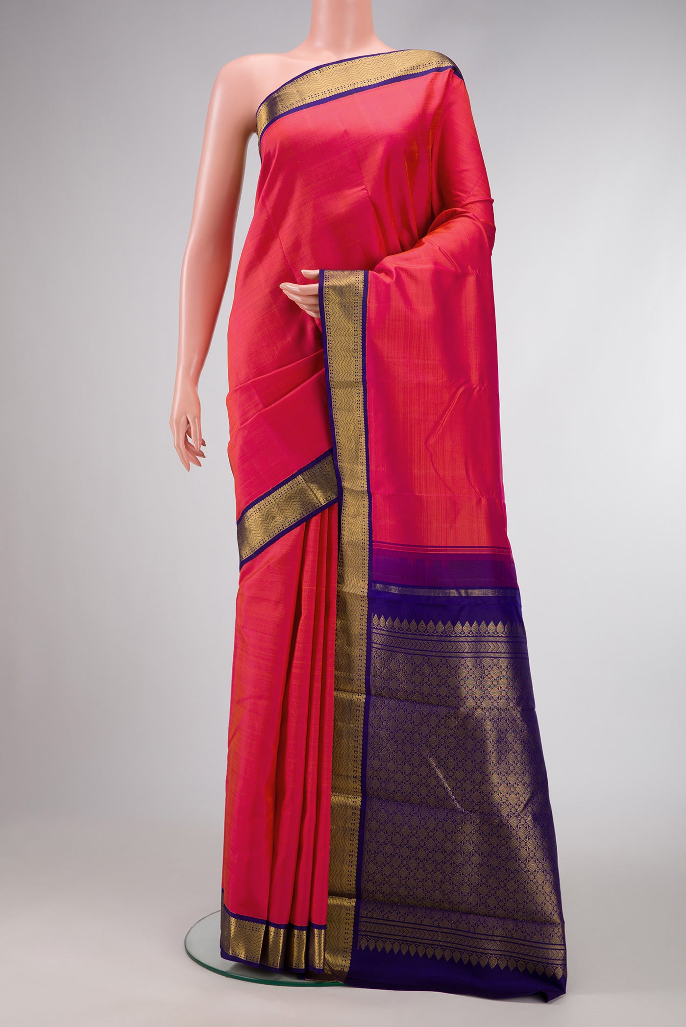 Pink Dual Tone Kanjivaram Silk Saree with Plain Body and Zari Border.  displayed on a mannequin