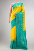 Pure Silk Pure Zari Yellow Dual Tone Kanjivaram Saree with Plain Body and Zari Border.  displayed on a mannequin