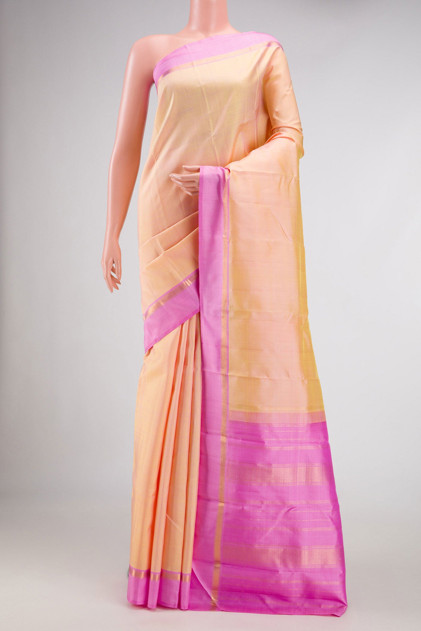 Sandal Dual Tone Kanjivaram Silk Saree with Plain Body and Zari Border.  displayed on a mannequin